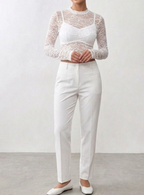 BLUSA DE RENDA MANGA LONGA COM ZIPER NAS COSTAS.